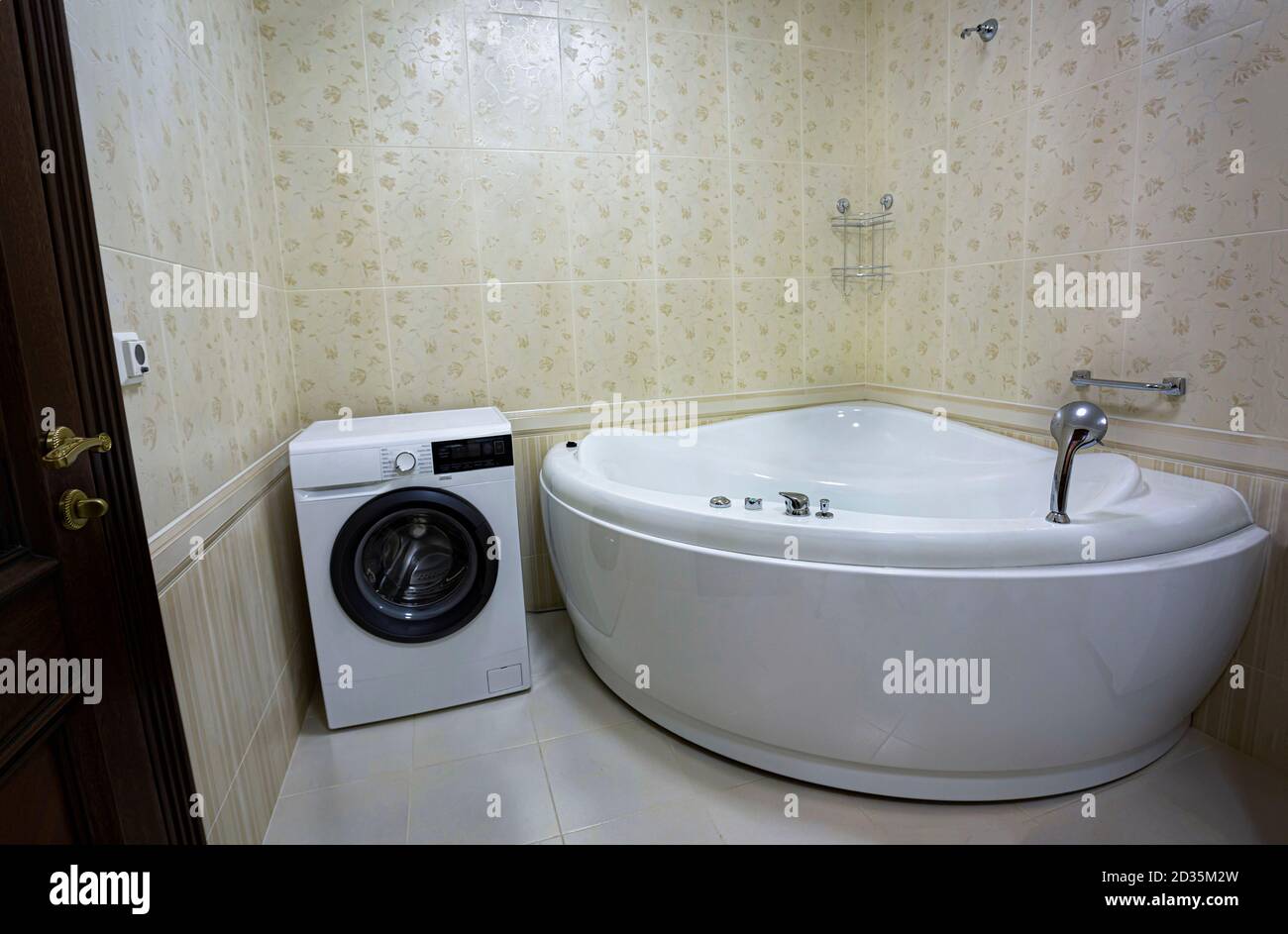 Modern bathroom with jacuzzi bath, copy space Stock Photo - Alamy