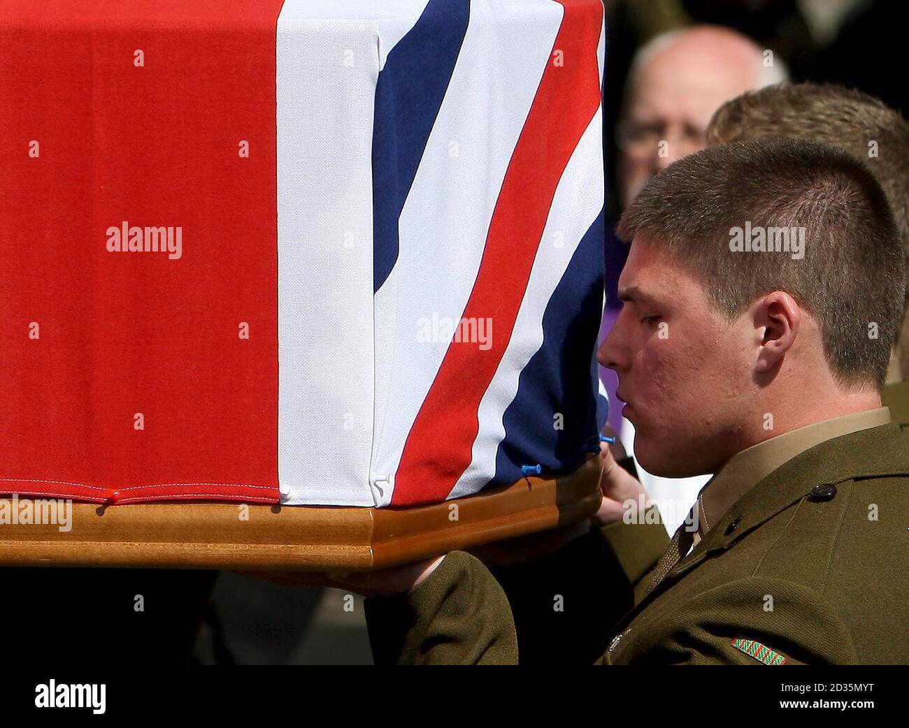 Andrew Holkham carries the coffin his brother Rifleman Daniel Holkham, 19, of 3rd Battalion The Rifles into All Saints Church, in Eastchurch, Kent. Stock Photo