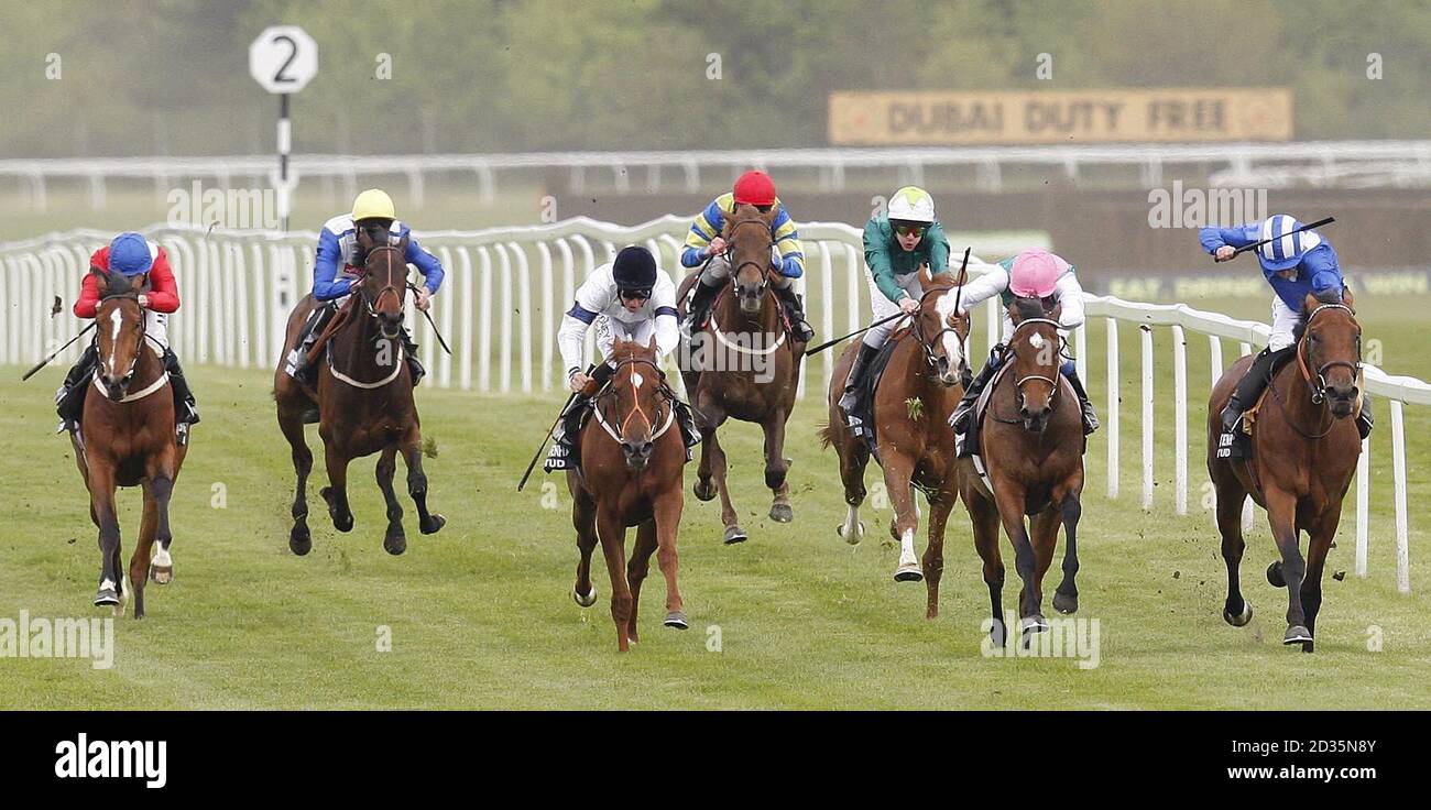 Principal Role and jockey Eddie Ahern (second right) go on to win the Swettenham Stud Fillies' Trial Stakes at Newbury Racecourse. Stock Photo
