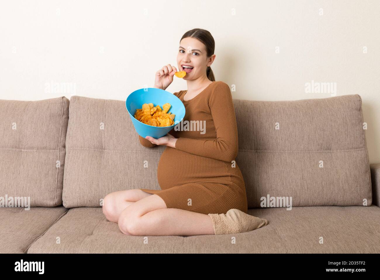 Woman sitting sofa fat hi-res stock photography and images - Page