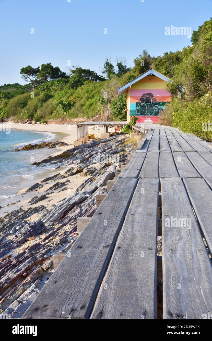 Food bridge on a beach in Thailand Krabi leading to a wooden hut with graffiti Stock Photo