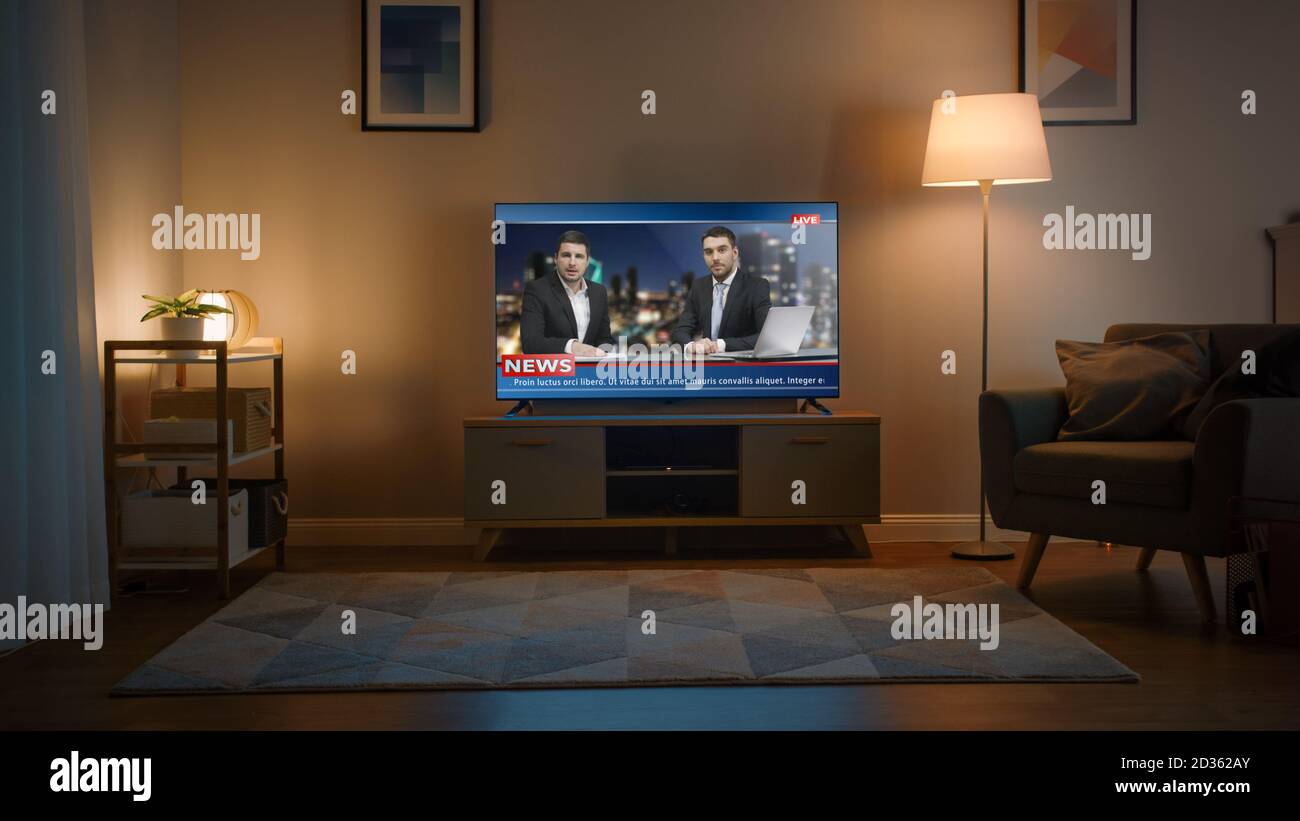 Shot of a TV with Live News Channel. Cozy Living Room at Day Time with