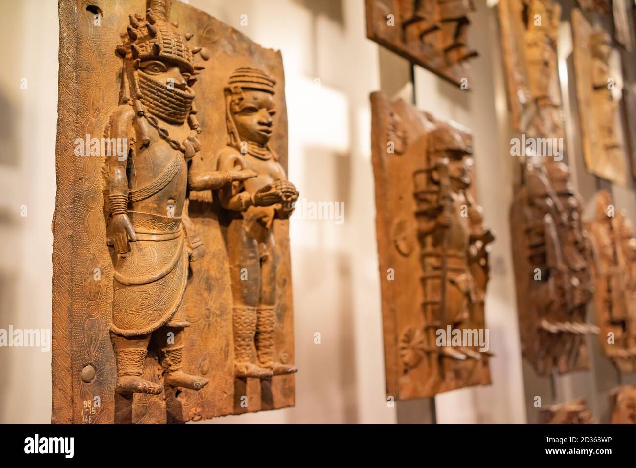 London. England. Benin Bronzes on display at the British Museum, brass plaques from the royal court palace of the Kingdom of Benin, 16-17th century Stock Photo