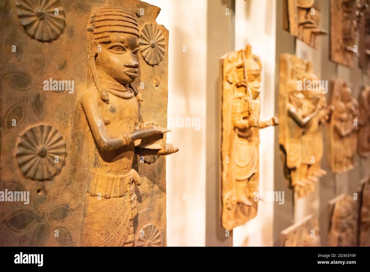 London. England. Benin Bronzes on display at the British Museum, brass plaques from the royal court palace of the Kingdom of Benin, 16-17th century Stock Photo