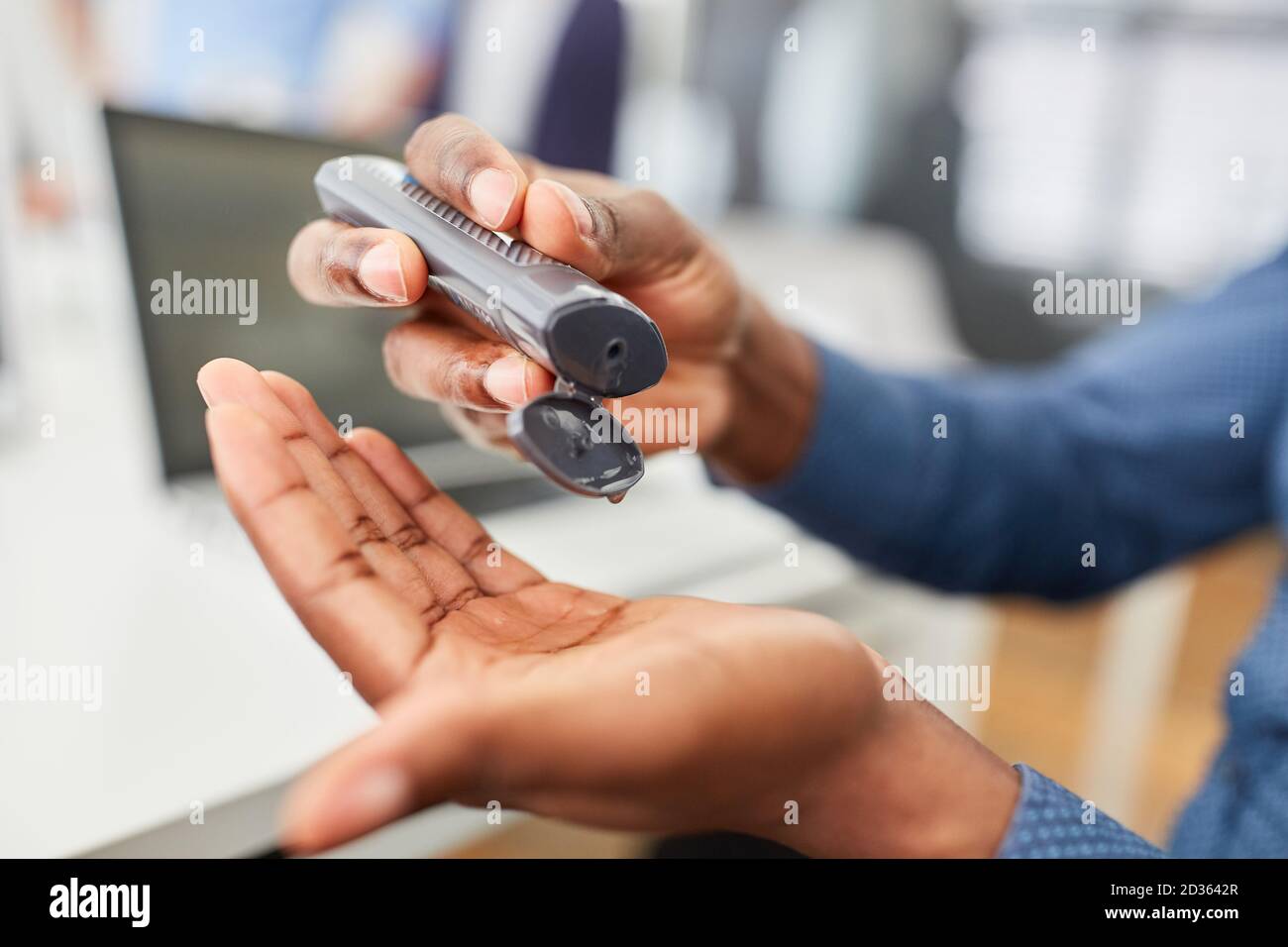 Hands of business man disinfecting with disinfectant Stock Photo