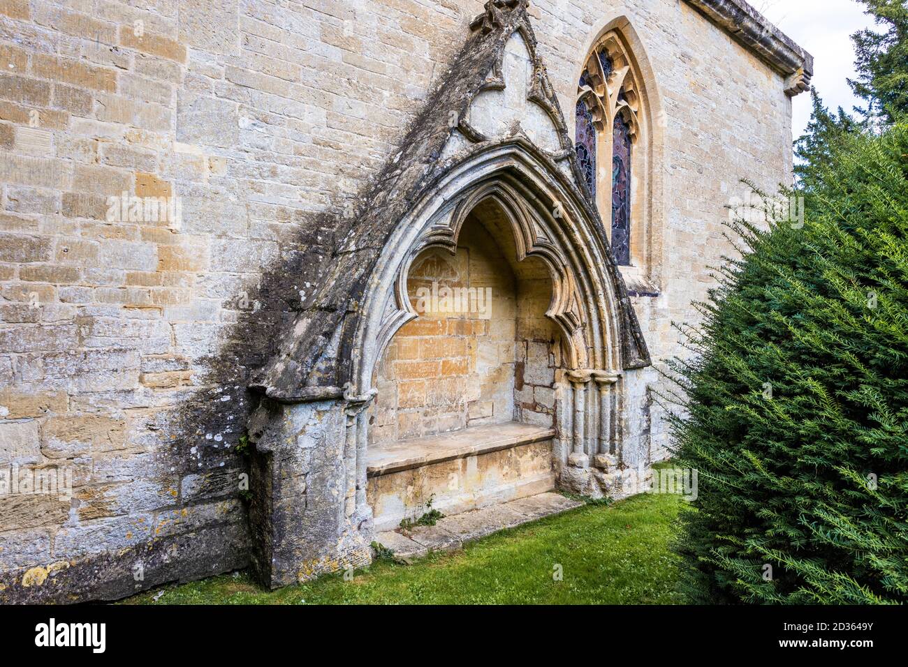 An ornate 13th century canopied recess on the south wall of the chancel of  the parish church of All Saints in the Cotswold village of Bisley, Glos. Stock Photo