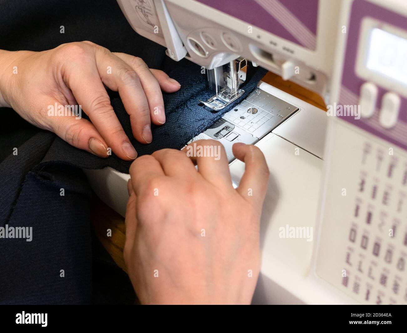 Closeup woman sewing machine hi-res stock photography and images - Alamy