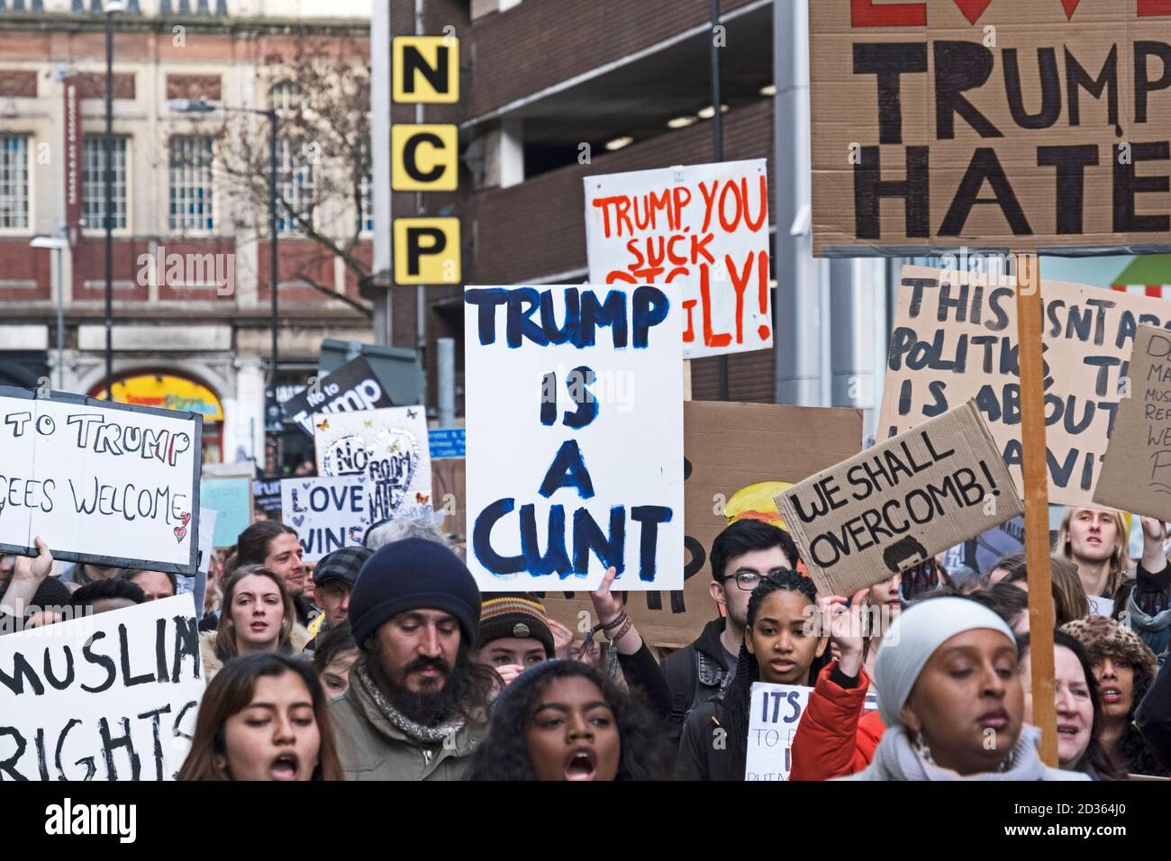 Protesters hold placards at a demonstration against US president Donald Trump’s immigration policies and his proposed visit to the UK in Bristol, UK on 4 February 2017 Stock Photo