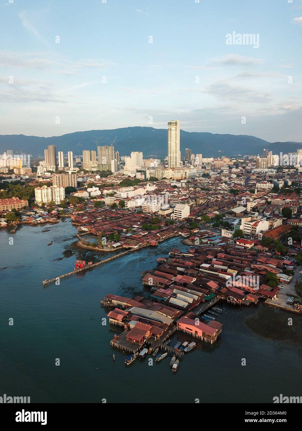 Georgetown, Penang/Malaysia - Feb 28 2020: Aerial Clan Jetty wooden house with background KOMTAR building. Stock Photo