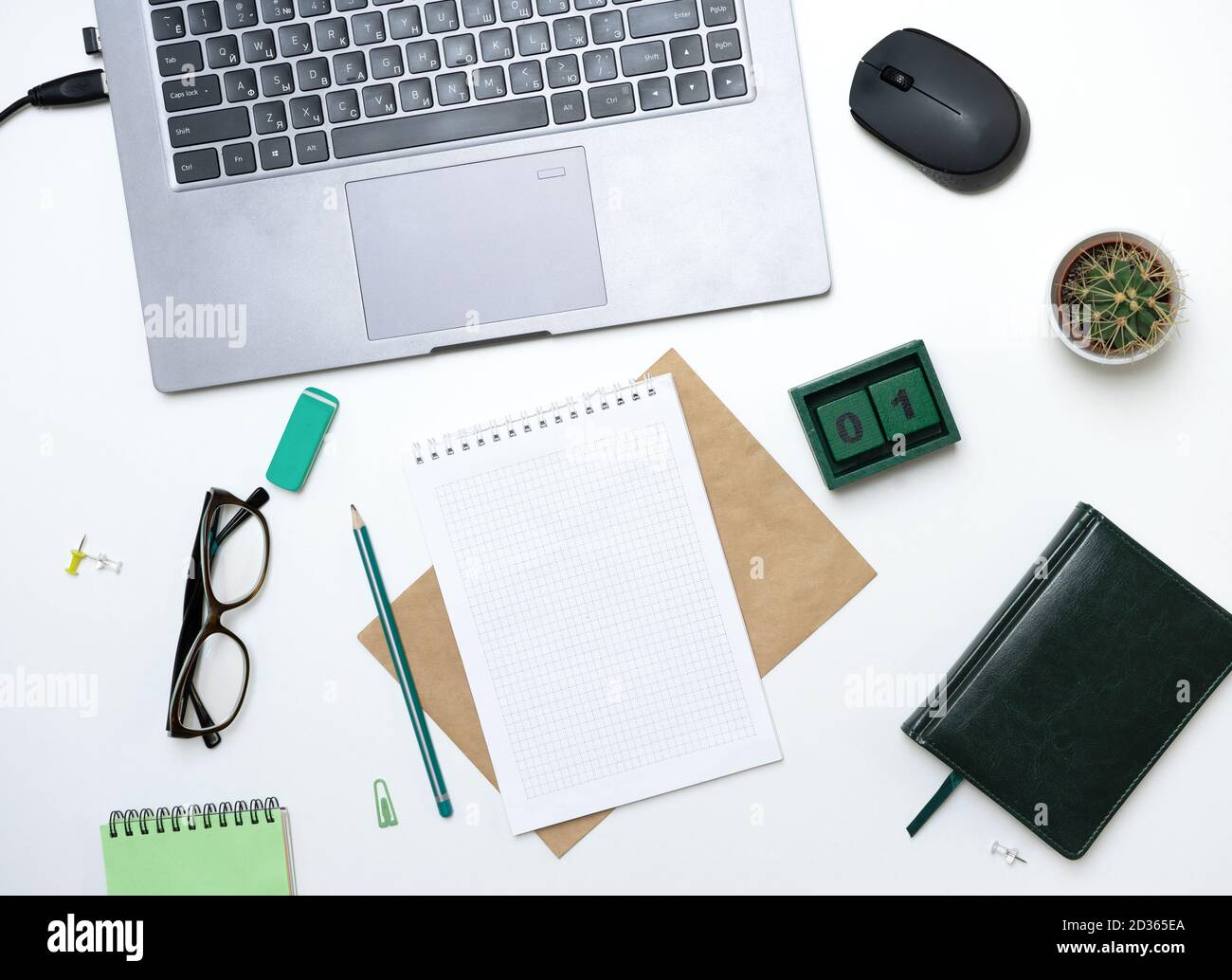 Office table with notepad, computer and notepad. View from above with