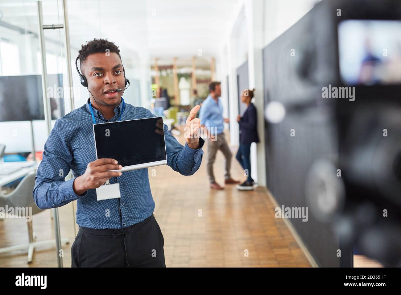 African business man as tutorial online coach in front of the video camera Stock Photo