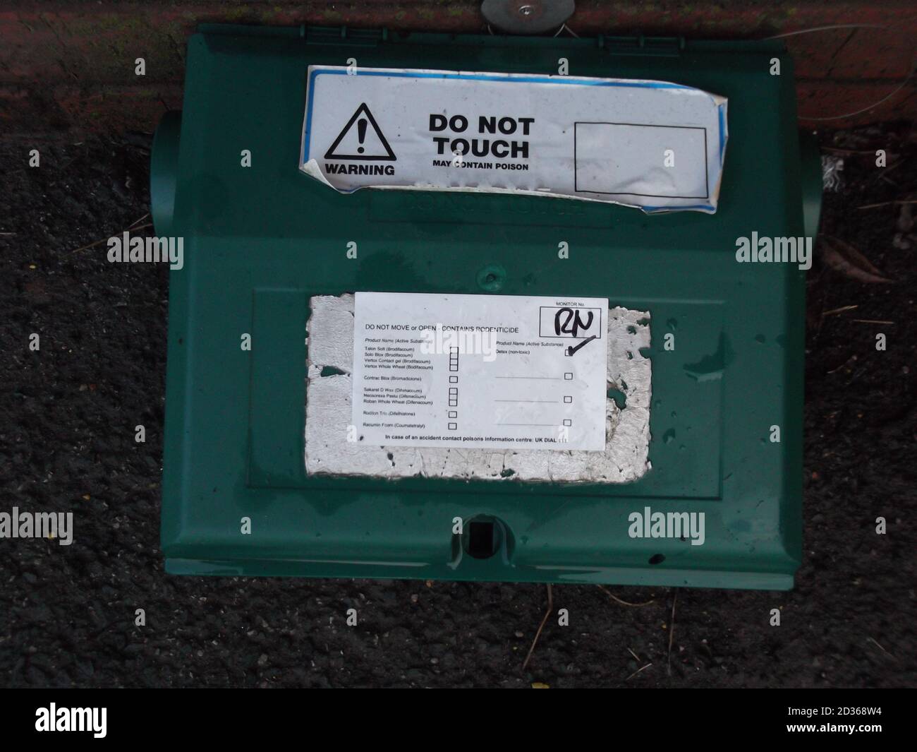 Green plastic rat poison box, rat bait station Stock Photo