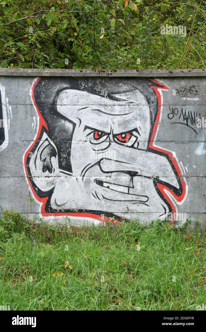 “Yo Manu” political satire. Spray painted graffiti caricature mocking French President Emmanuel Macron. Daubed on a wall in Montlhery, Essonne, France. Stock Photo