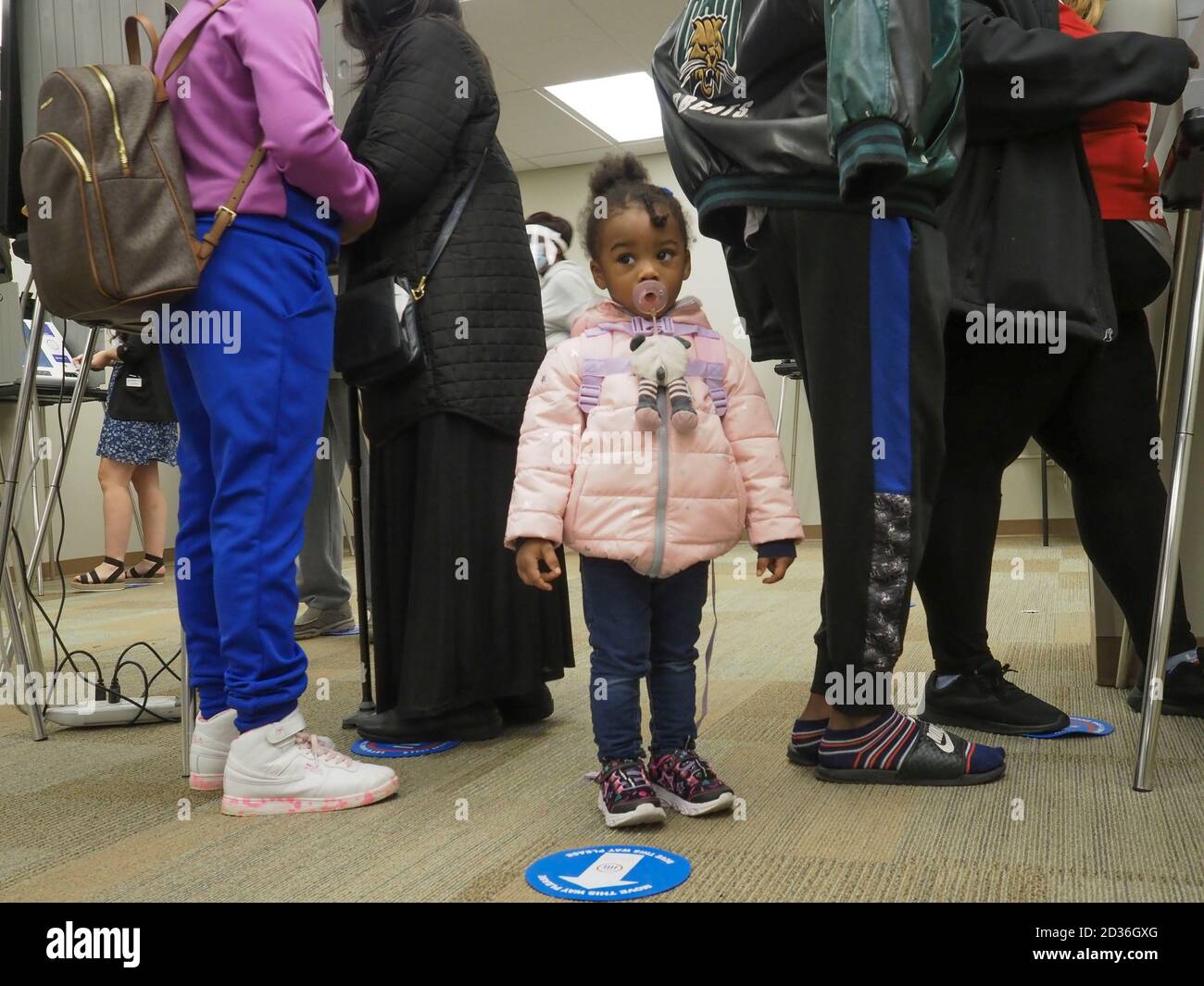Dayton, Ohio, USA. 6th Oct, 2020. JaÃ•bria Williams stands between her  mother, grandmother and siblings as the adults cast their votes at the  start of early voting. Credit: Sue Dorfman/ZUMA Wire/Alamy Live