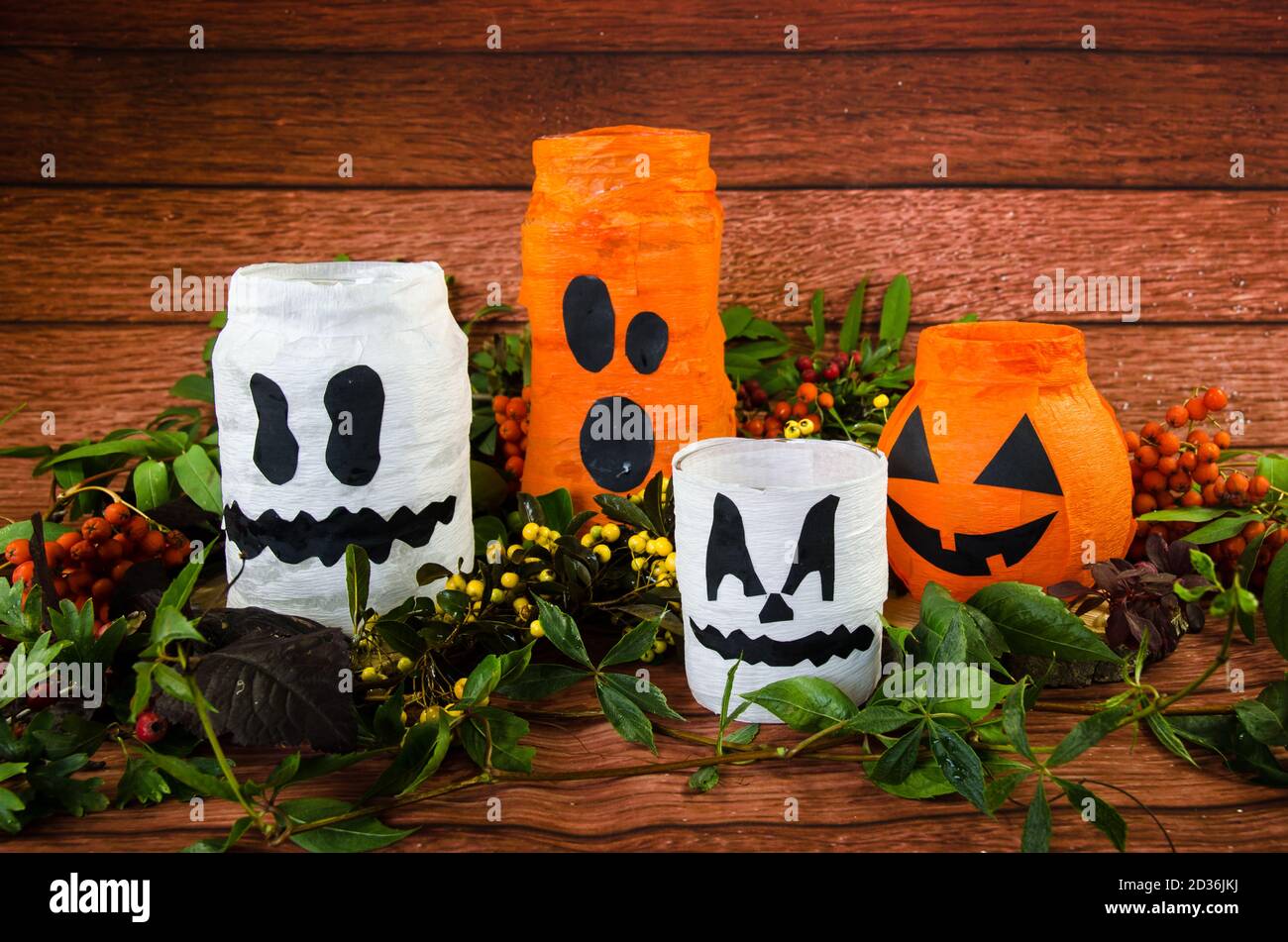 funny carved traditional halloween pumpkins with burning candle inside Stock Photo