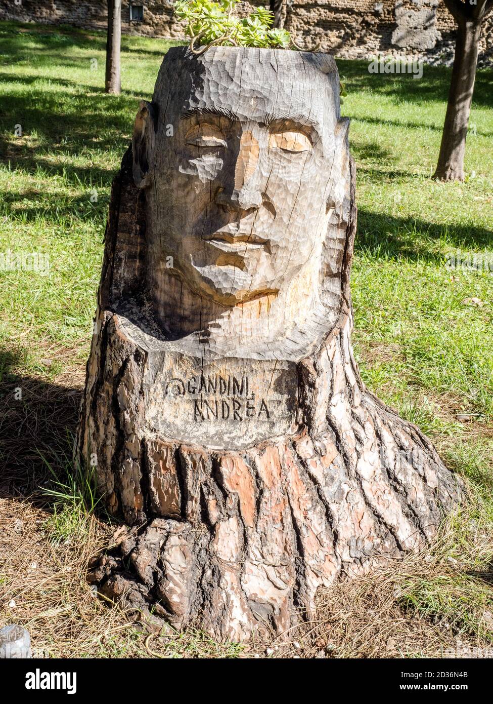 Wood sculpture depicting a face in the Orange Trees Garden (giardino ...