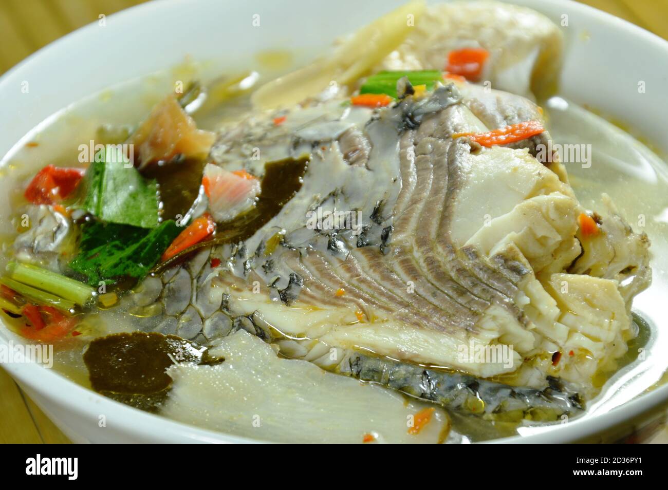 spicy boiled Tilapia fish in tom yum soup on bowl Stock Photo Alamy