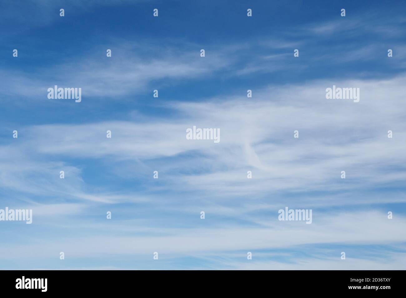 Cirrus clouds on blue sky, nature background without focus Stock Photo