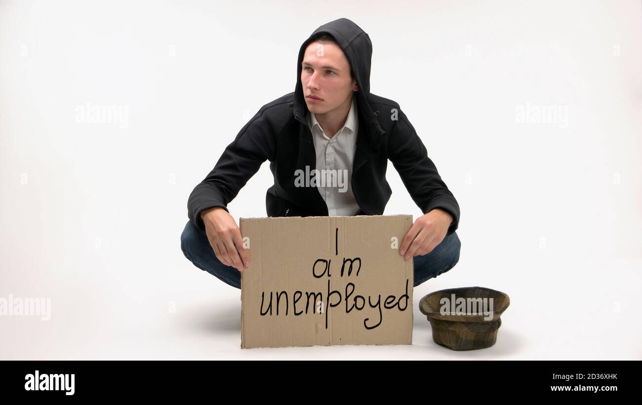 Man with cardboard sign text I am unemployed Stock Photo - Alamy