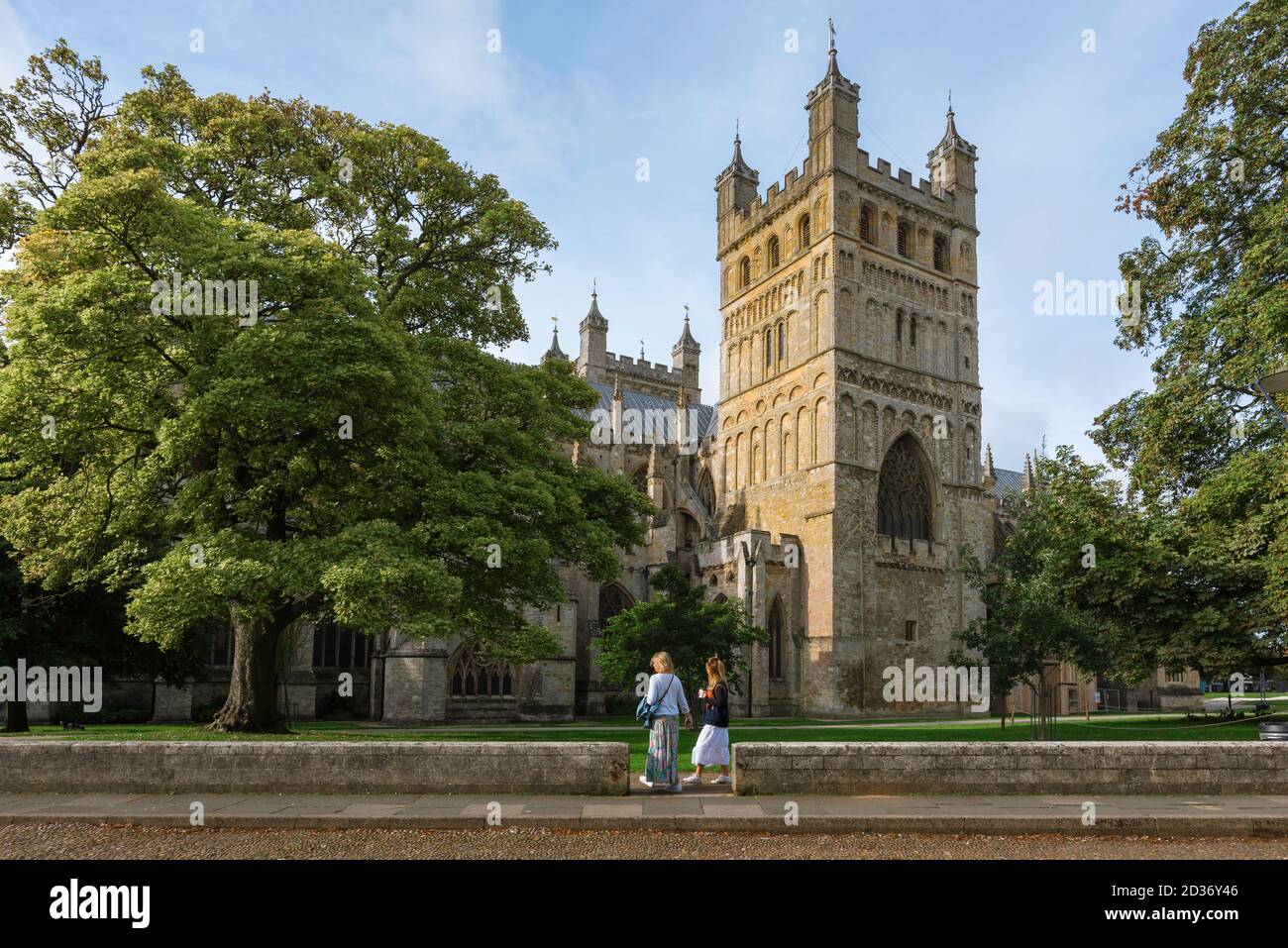 Exeter Cathedral, view in summer of people in the Cathedral Close looking at the north side of the Cathedral of St Peter in Exeter, Devon, England Stock Photo