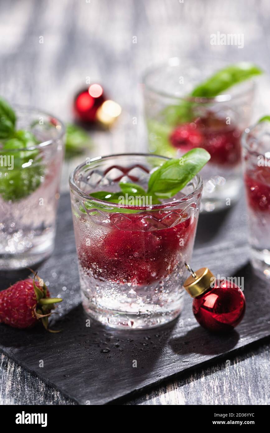 Alcohol shots of berries cocktail with a raspberry Stock Photo Alamy