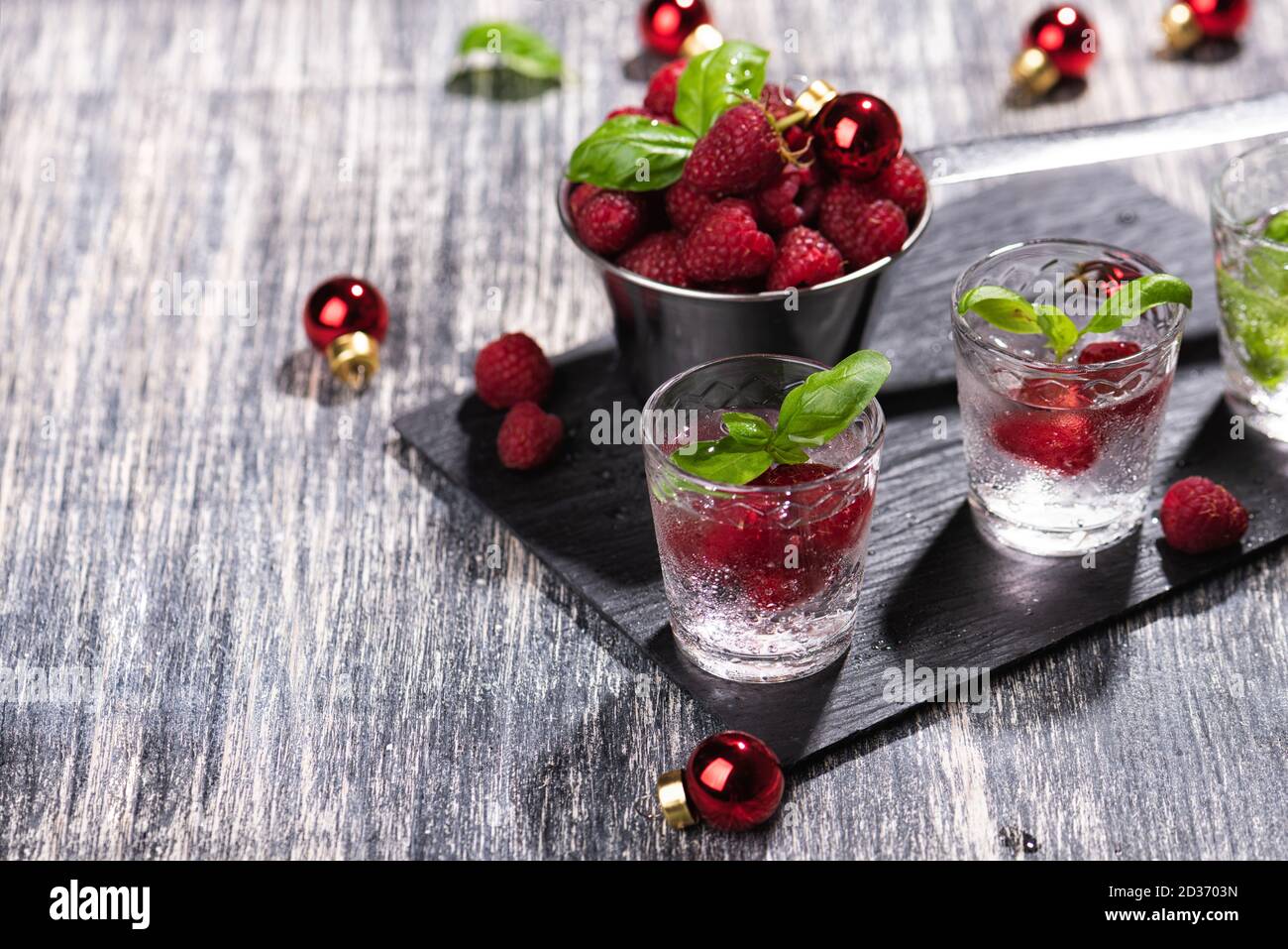 Alcohol shots of berries cocktail with a raspberry Stock Photo Alamy