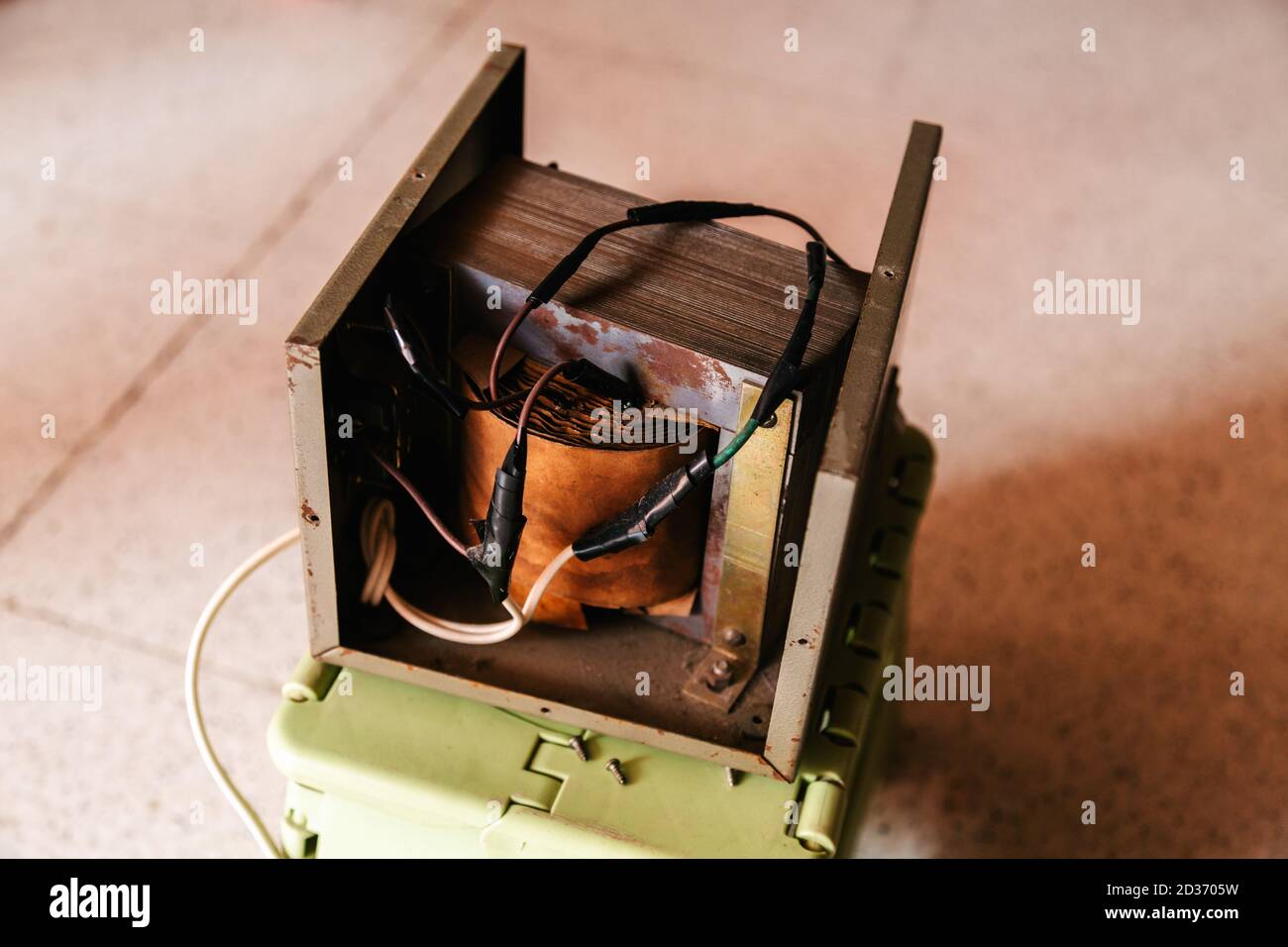 Old custom laminated core transformer 220V to 110V, interior view, iron