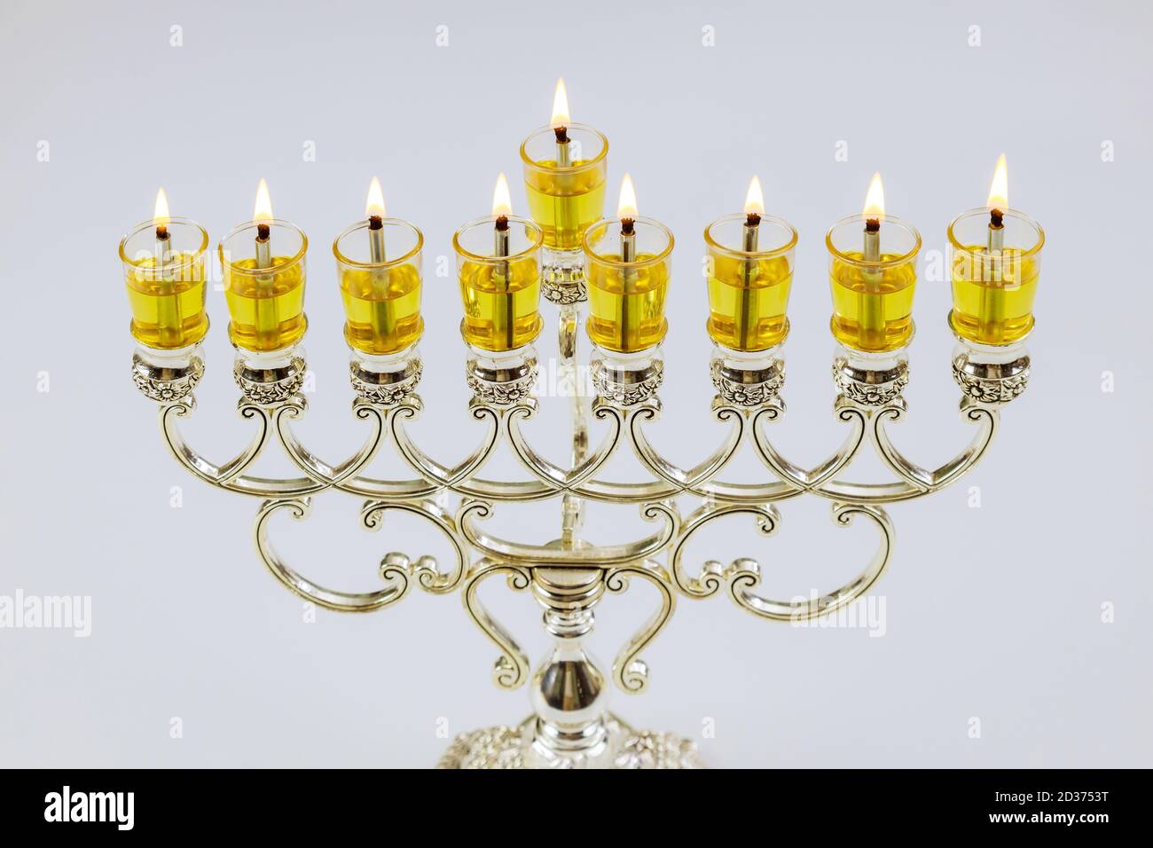 Lighting candles in menorah for Hanukkah in the Jewish Festival Stock