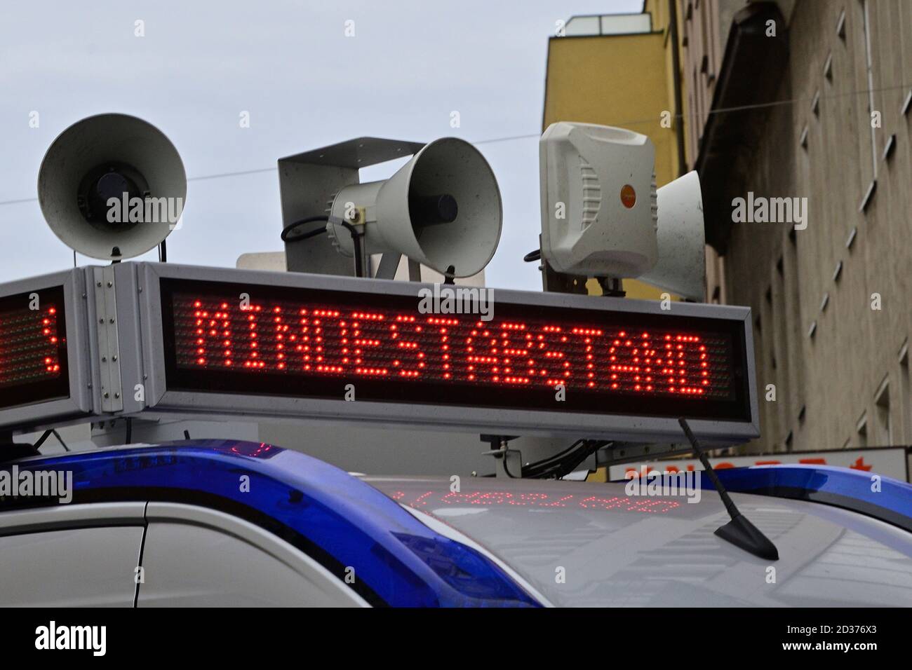 Vienna, Austria. 7th Oct, 2020. The “HC Strache Comeback Tour” campaign ends with a speech by top candidate Heinz Christian Strache and a live performance of the campaign song “HC IS BACK”. The picture shows a police car with the inscription 'Minimum distance'. Stock Photo