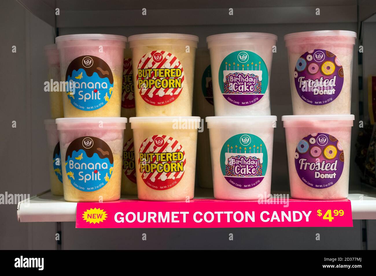 A selection of unusual flavors of cotton candy for sale at It'Sugar, a candy by the pound store on Broadway in Greenwich Village, New York City Stock Photo