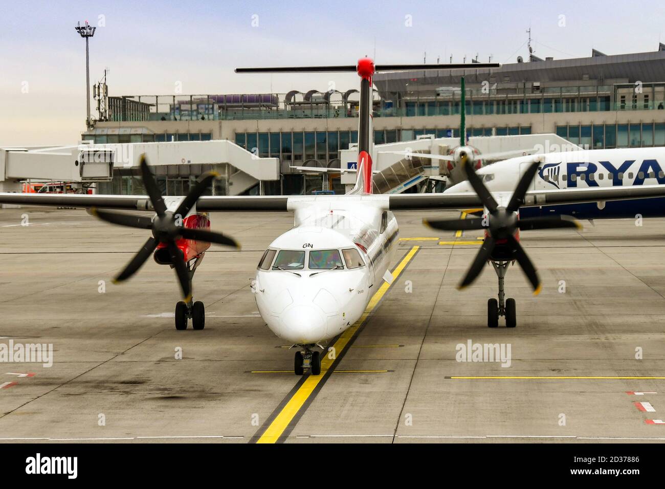 BUDAPEST, HUNGARY - MARCH 2019: Turboprop aircraft with engines running waiting to leave its stand at Budapest airport. Stock Photo