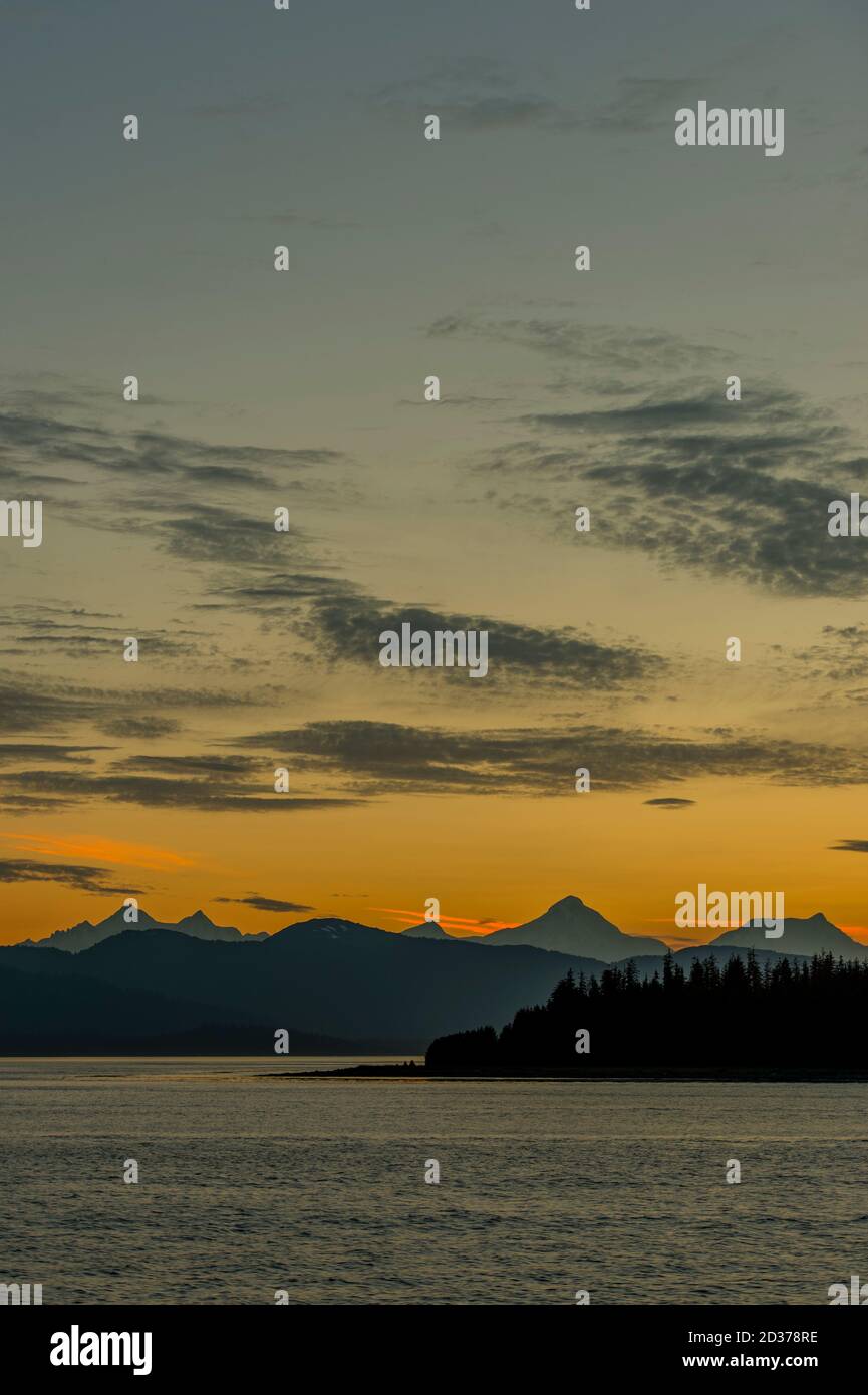View of Fairweather Mountain range at sunset from the Sitakaday Narrows near Bartlett Cove, Glacier Bay National Park, Alaska, USA. Stock Photo