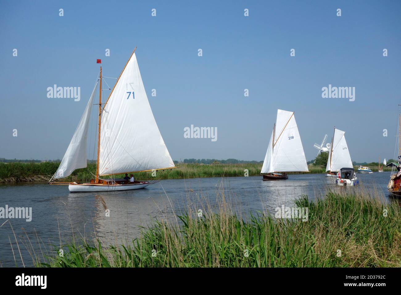 Sailing cruisers starting in the Cock of the Broads race at the Thurne Mouth Regatta Stock Photo