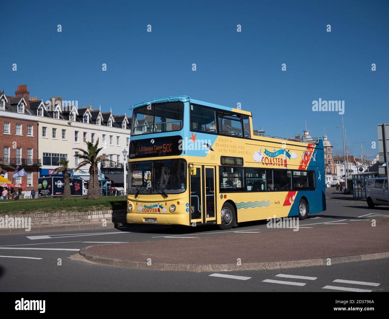 First Wessex open top Bus showing off the new Portland Coaster branding on the esplanade at Weymouth Stock Photo