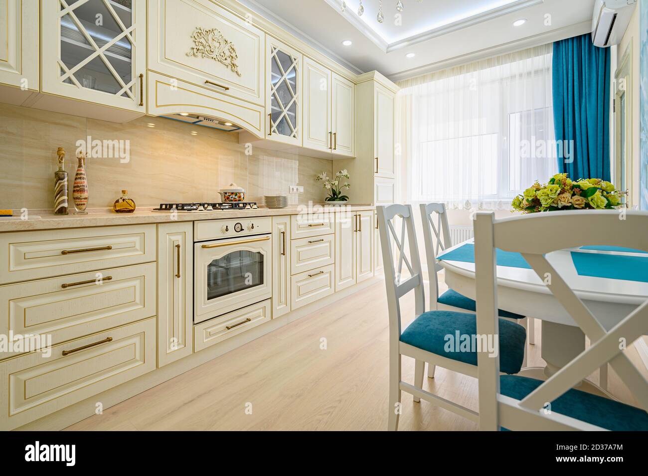 Beige, white and cyan furniture at kitchen in provence style Stock Photo Alamy
