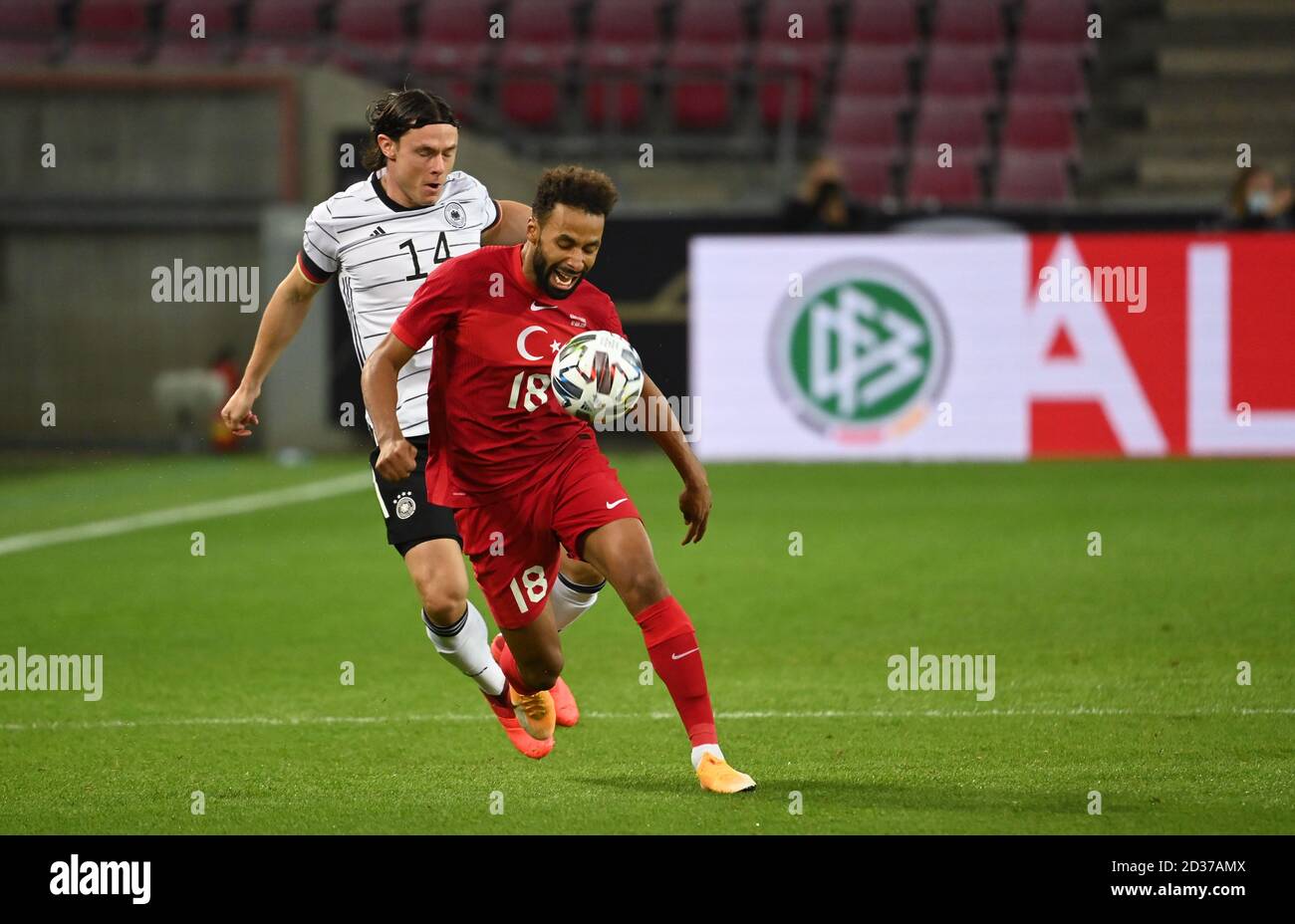 Cologne, Germany. 07th Oct, 2020. Football: international matches, Germany - Turkey in the RheinEnergieStadion. Nico Schulz (Germany) in action with Nazim Sangare (r, Turkey). Credit: Federico Gambarini/dpa/Alamy Live News Stock Photo