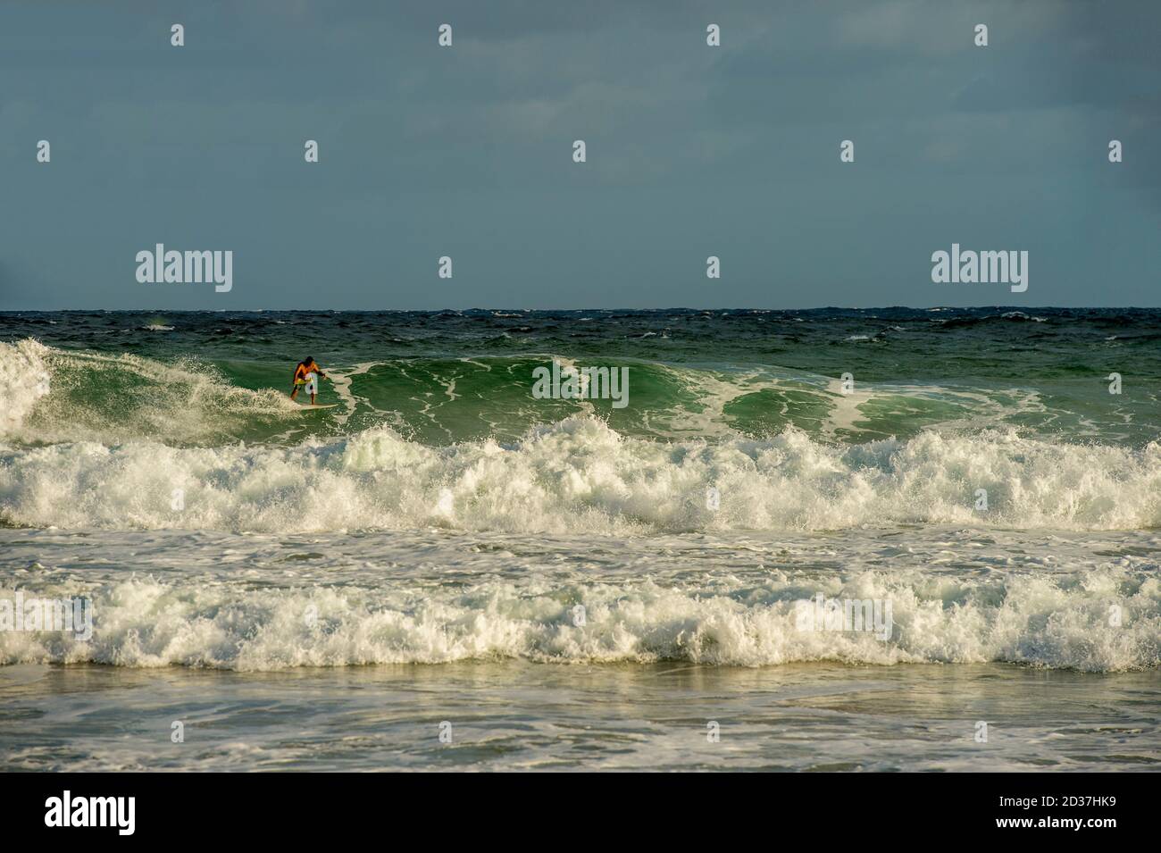 Surfers at Kealia beach which is Kapaa's premier surfing beach on Kauai