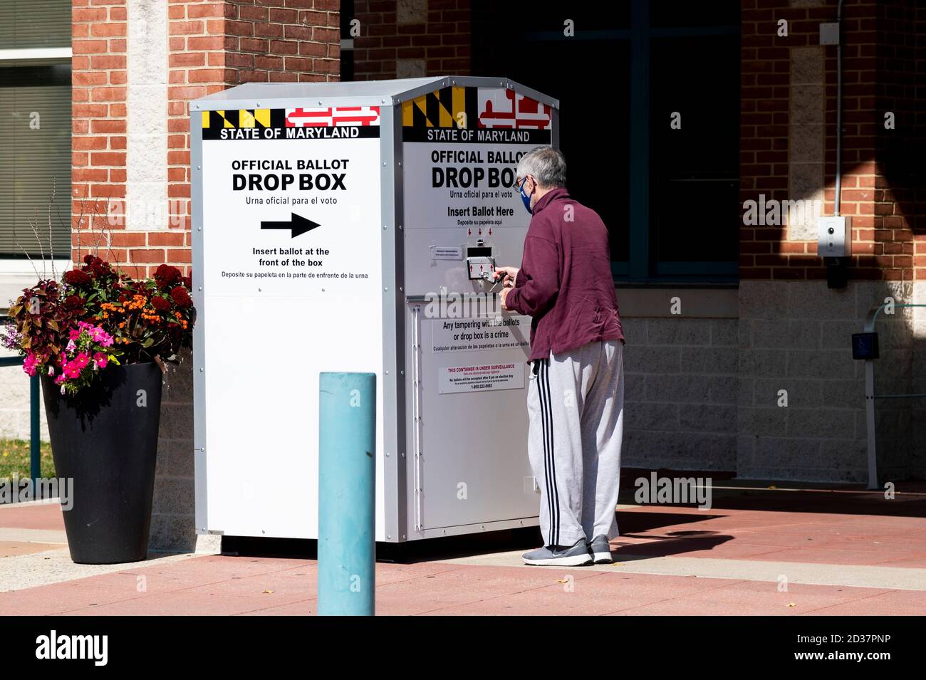 Bethesda, MD, USA. 7th Oct, 2020. October 7, 2020 - Bethesda, MD, United States: A man standing in front of the ballot drop box in front of Walt Whitman High School. Credit: Michael Brochstein/ZUMA Wire/Alamy Live News Stock Photo