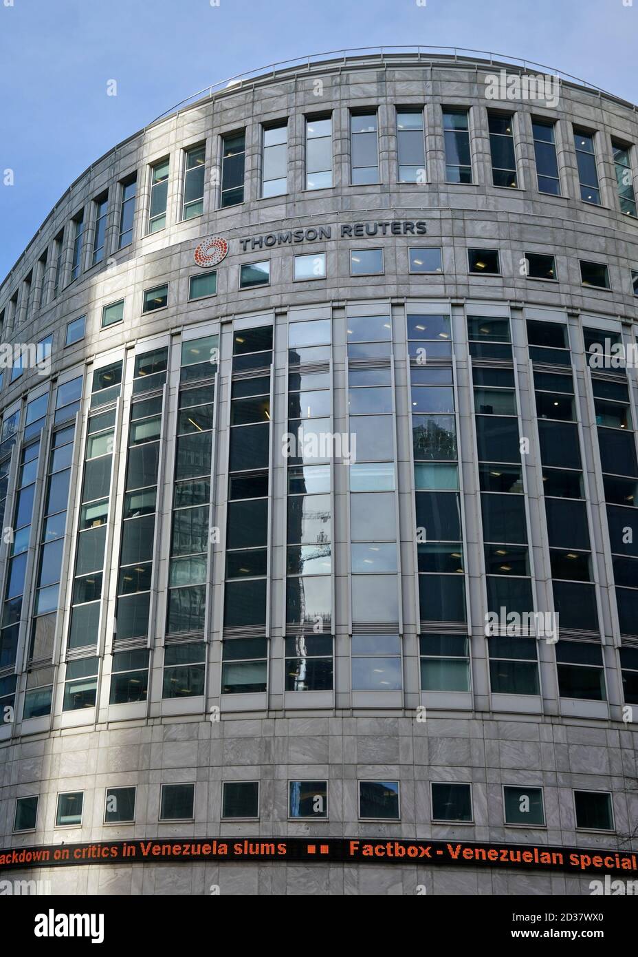 London, United Kingdom - February 03, 2019: Sun shines on Thomson Reuters offices building at Canary Wharf in UK capital. TR Group is Canadian multina Stock Photo