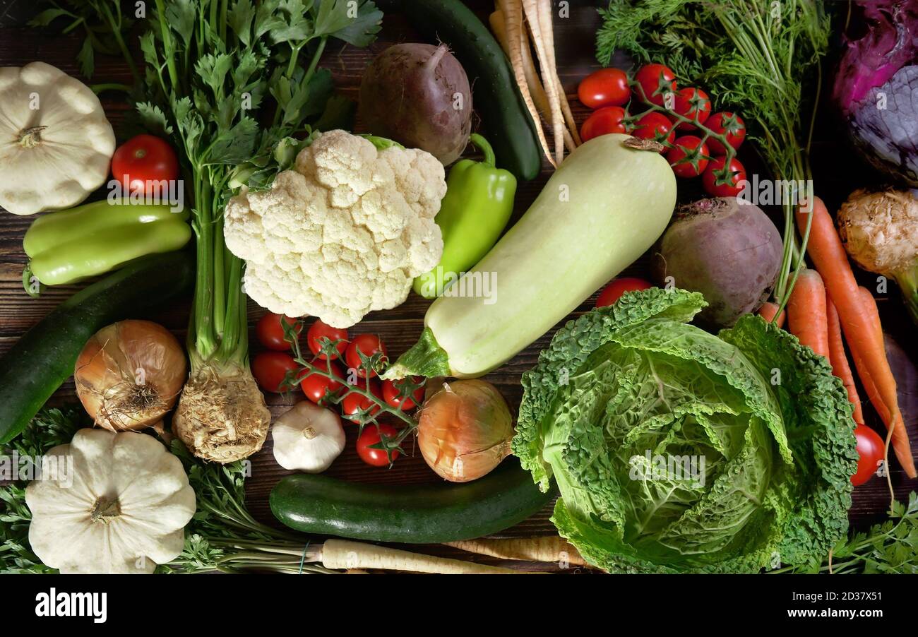 Top down of various vegetables on dark wood board. Healthy vegetable concept Photo - Alamy