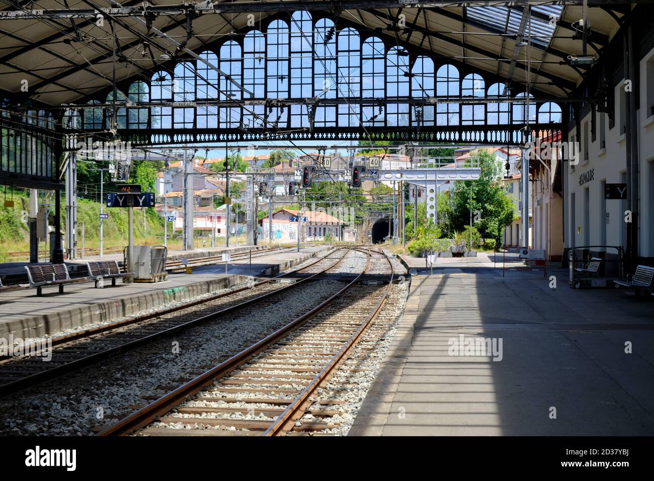 Empty platform looking out structure of the Bayonne Train station Stock