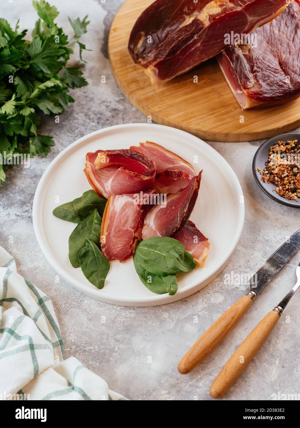 pastrami sliced on a plate with herbs Stock Photo Alamy