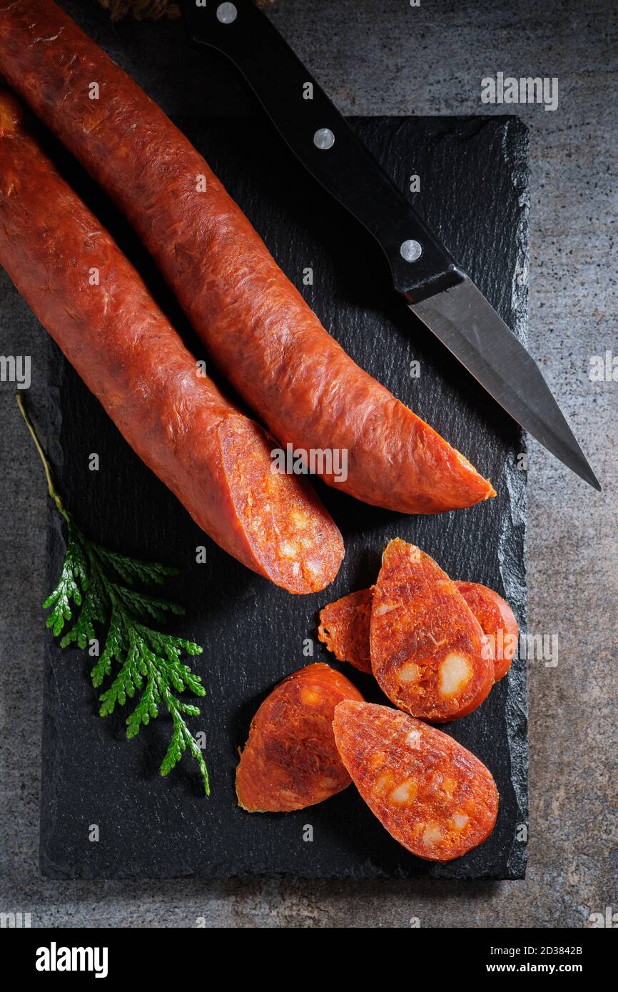 Traditional Spanish sausage chorizo on slate stone Stock Photo Alamy