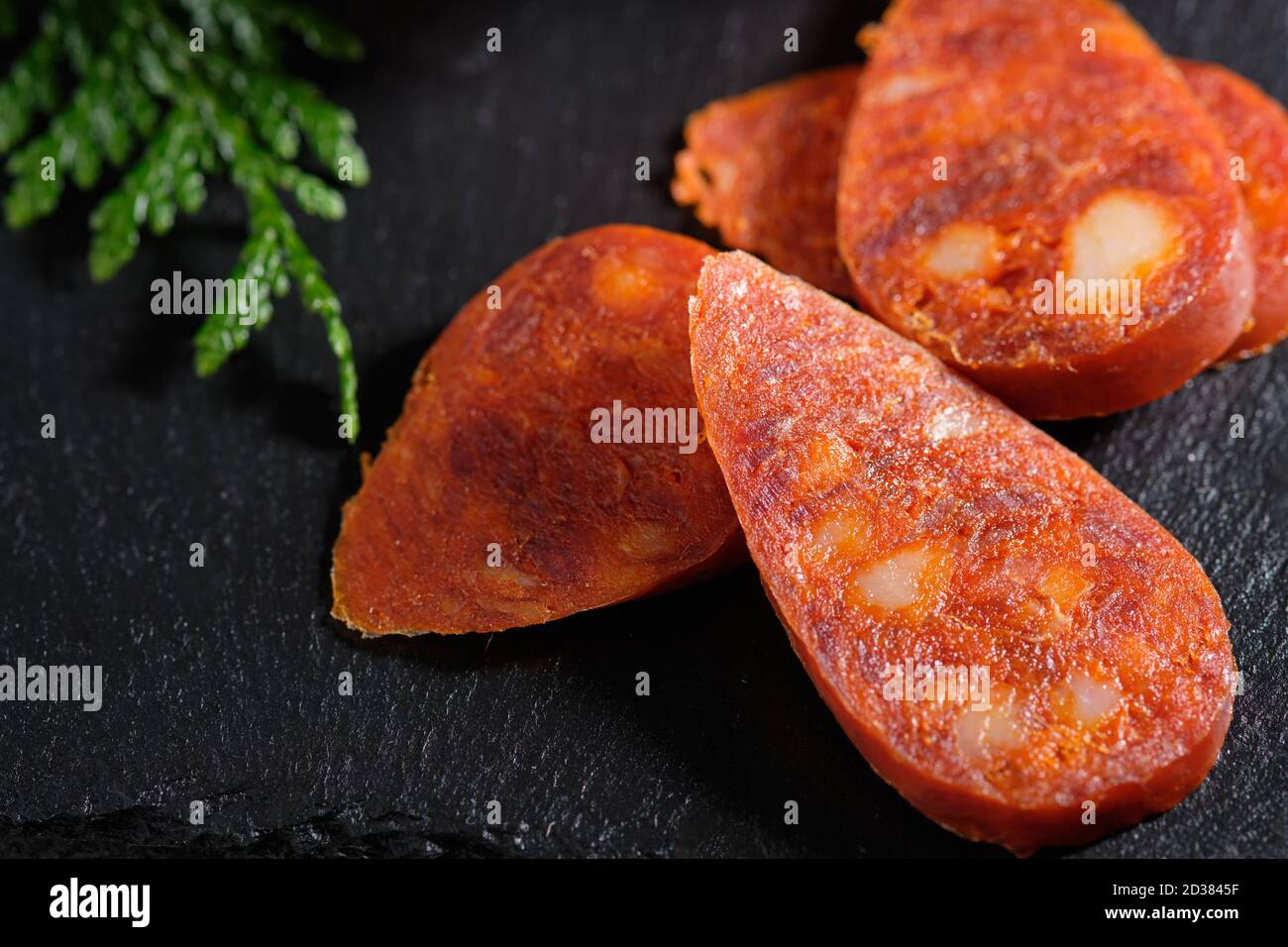 Traditional Spanish sausage - chorizo on slate stone Stock Photo - Alamy