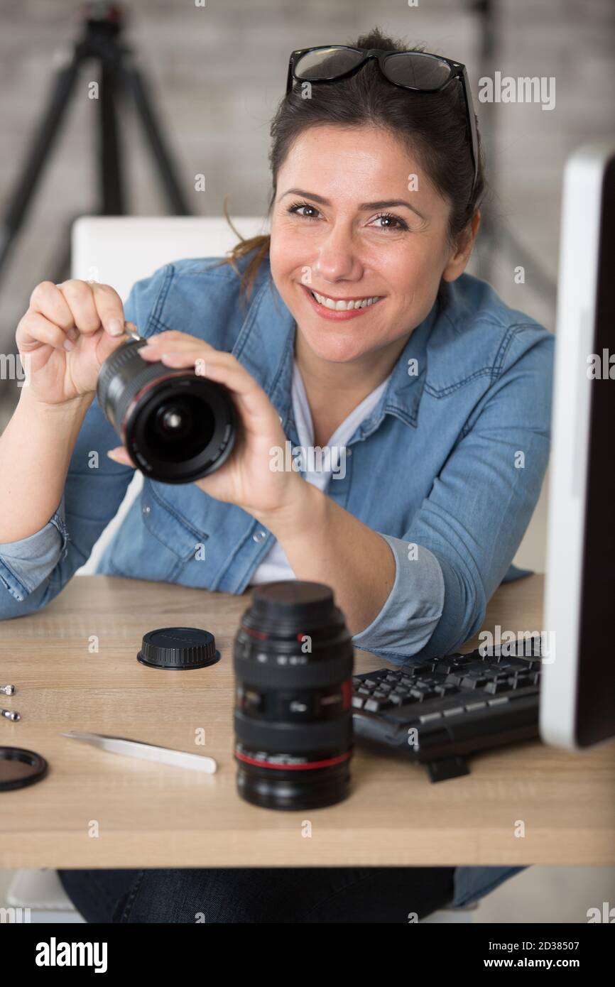 woman repairing a camera lens Stock Photo Alamy