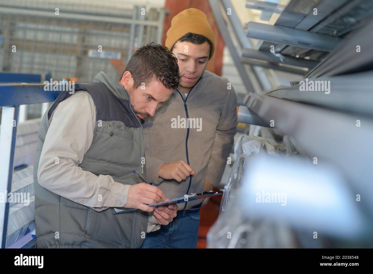 men working in newspaper factory Stock Photo