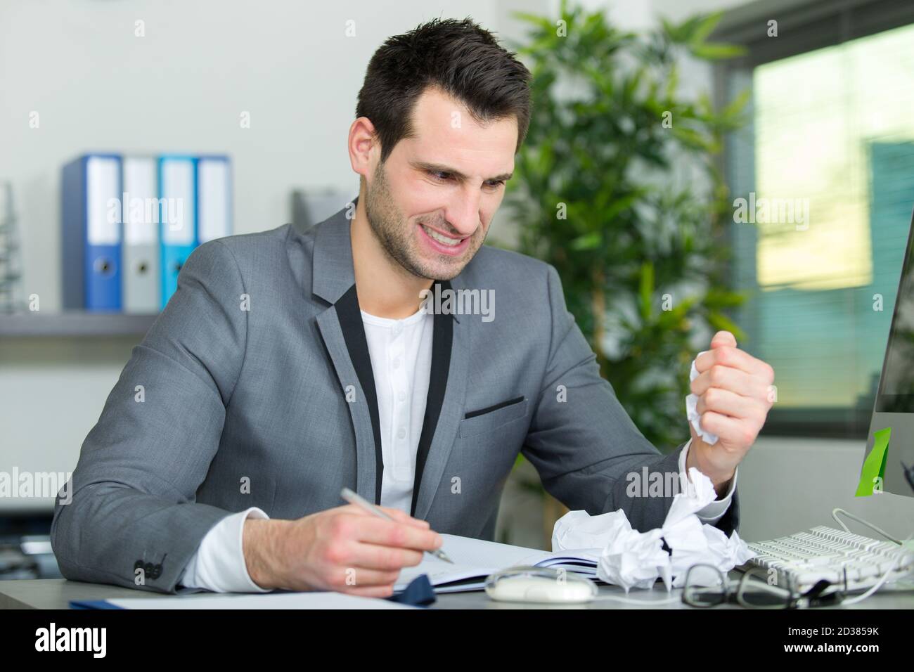 upset businessman in his office Stock Photo