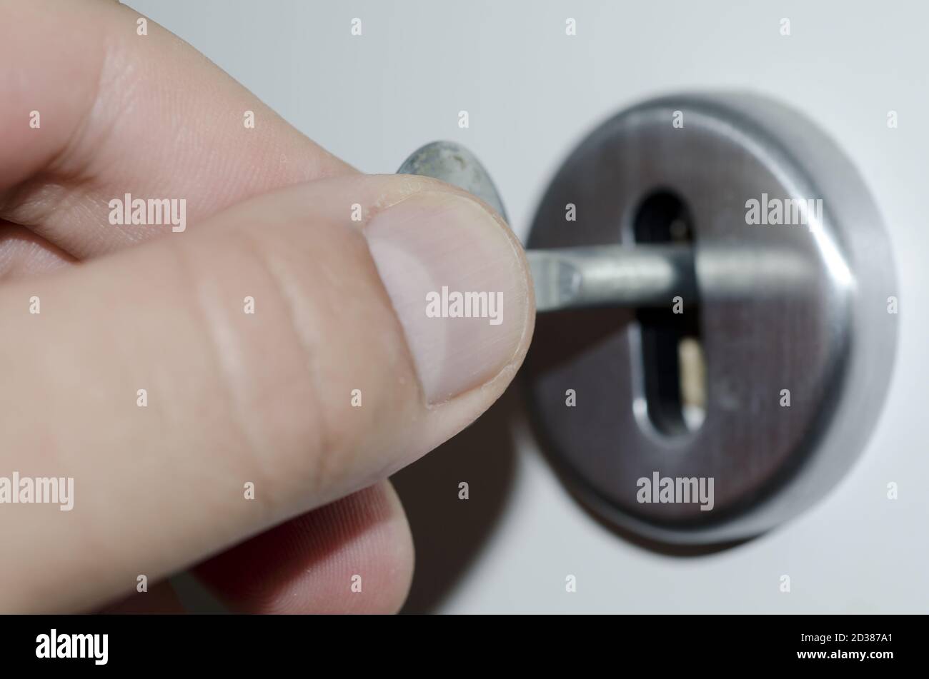 hand-turns-the-key-in-the-lock-stock-photo-alamy