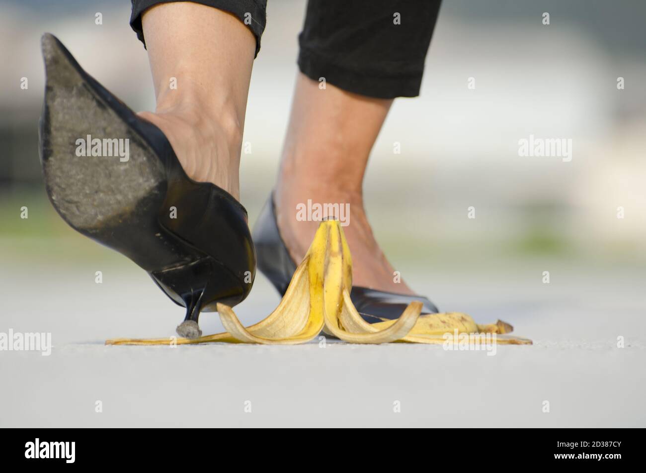 Woman slipping on banana hires stock photography and images Alamy