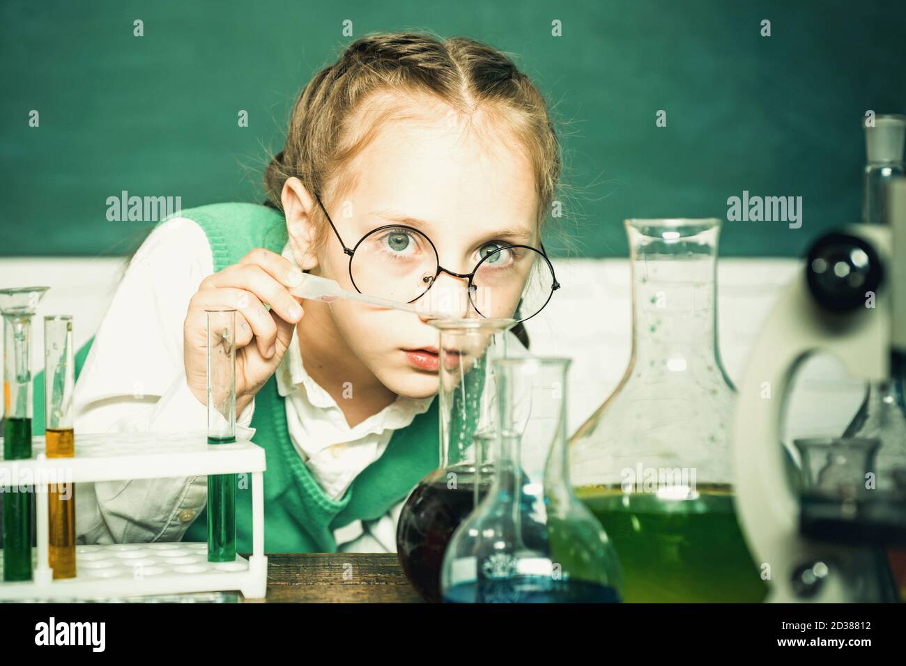 Lab microscope and testing tubes. My chemistry experiment. Back to